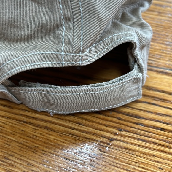 Greg Norman brand tan cap.  Velcro to adjust size in back.  Good condition. OS - Picture 5 of 8